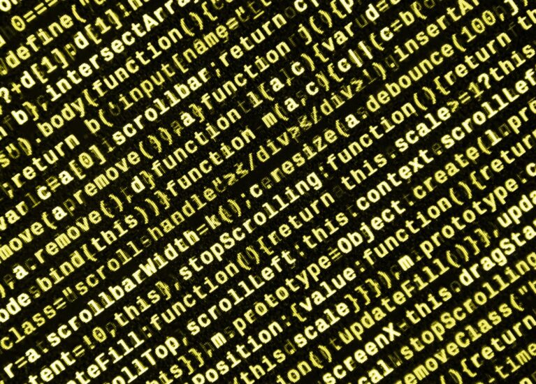 Big data and Internet of things trend. IT specialist workplace. Website HTML Code on the Laptop Display Closeup Photo. Big data storage and cloud computing representation